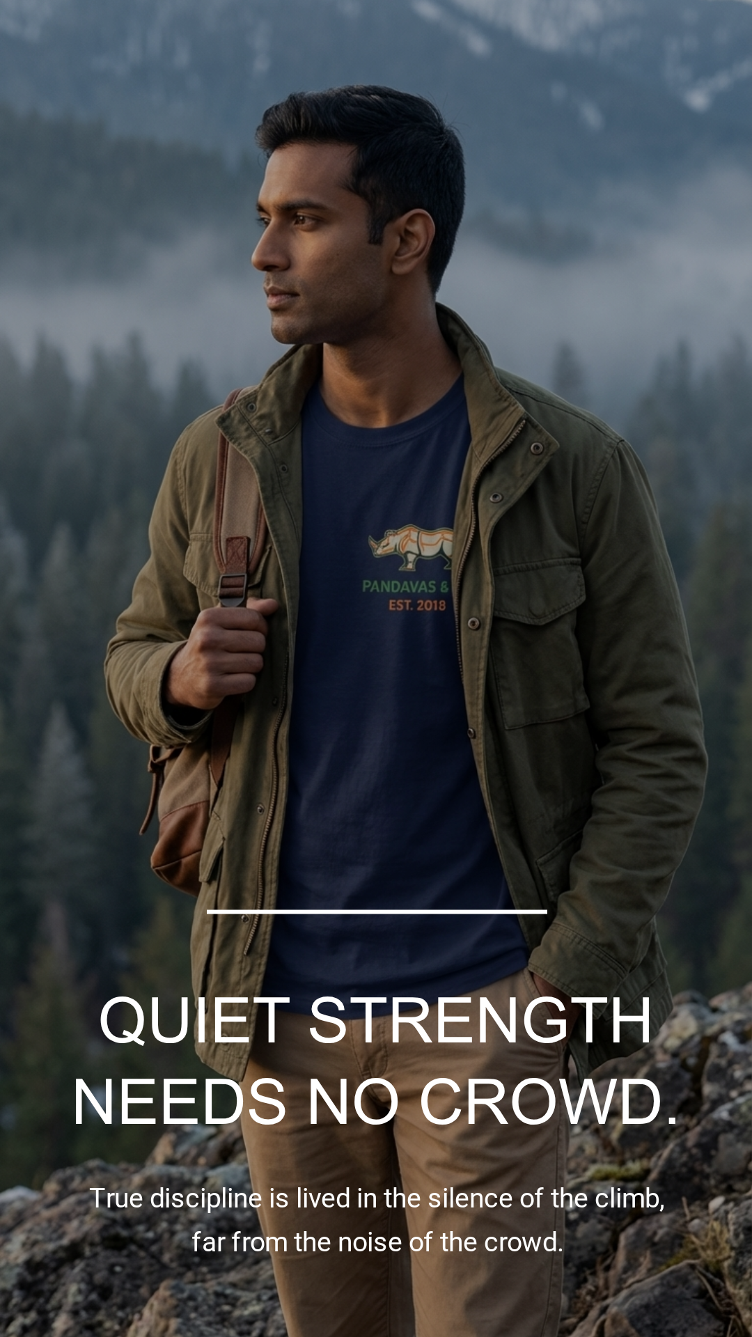 Man standing in a mountainous landscape with a quote about quiet strength.